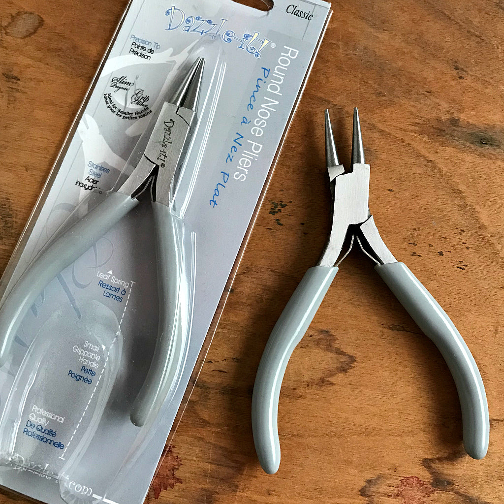 This Suzie Q Studio “Round Nose Plier” is used for shaping wire into round loops and curves, which is why it’s an essential tool to make a BEAD STEW bracelet because you use it to create a loop to close off the end of your bracelet. This will stop the beads from sliding off the end of the memory wire.
