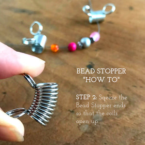 Suzie Q Studio's “must have” bead stringing invention, the Bead Stopper, prevents the beads on your bead stringing wire from slipping off the end while you create your design. They’re super-easy to use… Simply squeeze the rings to open the coils, slide in your bead stringing wire, release the rings and you’re ready.