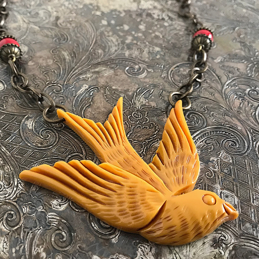 Suzie Q Studio carries HOTCAKES DESIGN retro-style, handmade jewelry taking its inspiration from classic Bakelite jewelry, vintage images and bold color. You'll feel happy-go-lucky with this faux-bakelite “Swallow” around your neck!