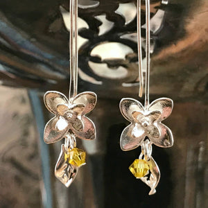 This Suzie Q Studio earring collection features handmade earrings created by Suzie Q Studio artisans. If you love a more delicate, modern-natural look, these precious, handcrafted sterling silver flower earrings, with a hint of Swarovski sparkle, are perfect for you and they're available in a variety of gorgeous colors.