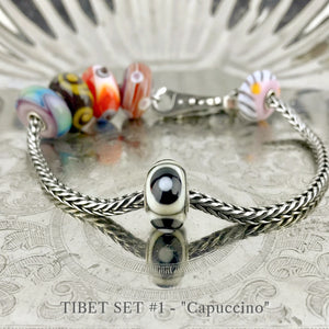 Now available at Suzie Q Studio, the ultra-rare Trollbeads Tibet Beads. This shows the Capuccino Tibet Bead in Set 1.
