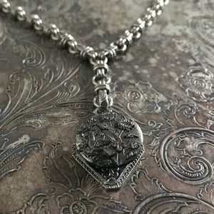 One-of-a-kind MY MOTHERS BUTTONS jewelry is handcrafted using the finest antique buttons. This “Y”-Style necklace has the most precious antique button of a little bird singing in the garden.  