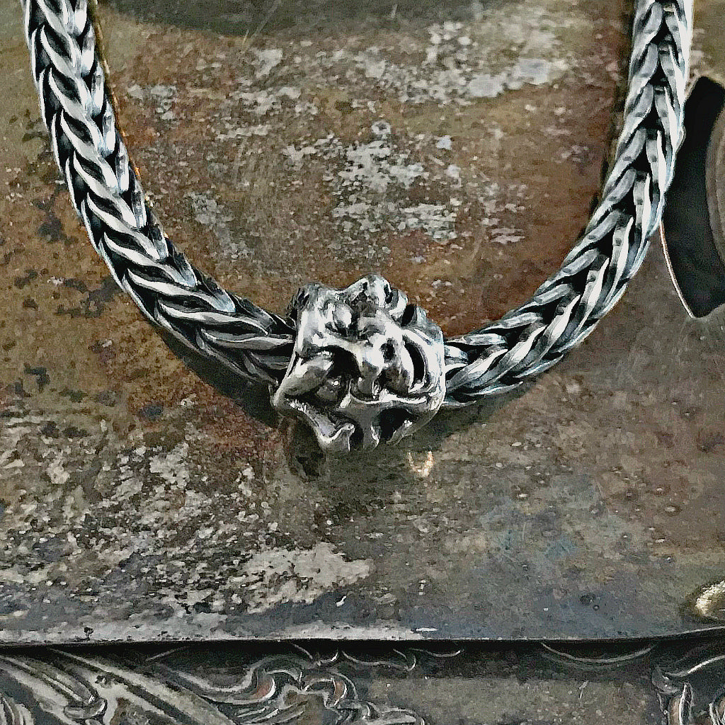 Suzie Q Studio has a treasure vault full of Rare and Retired Trollbeads... and we’re making them available to you. This is a super-rare and super-cool Trollbead! Amazingly, Trollbeads artisan, Søren Nielsen, found room for five different faces, each in its own mood!