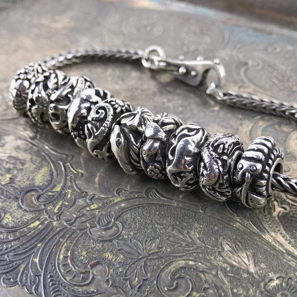 Now available at Suzie Q Studio, the complete set of 10  Trollbeads China Limited Edition Sterling Silver Beads. All NEW stock and never worn.