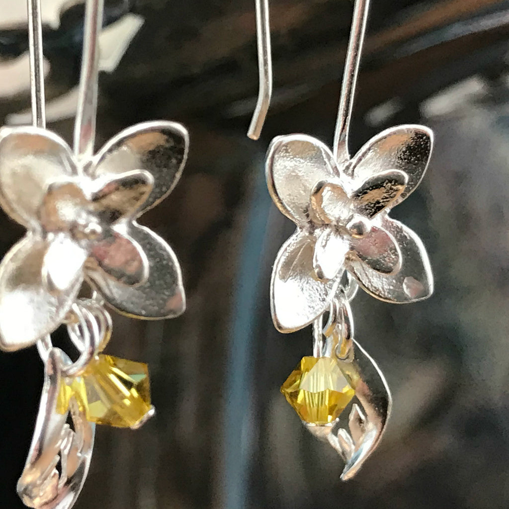 This Suzie Q Studio earring collection features handmade earrings created by Suzie Q Studio artisans. If you love a more delicate, modern-natural look, these precious, handcrafted sterling silver flower earrings, with a hint of Swarovski sparkle, are perfect for you and they're available in a variety of gorgeous colors.