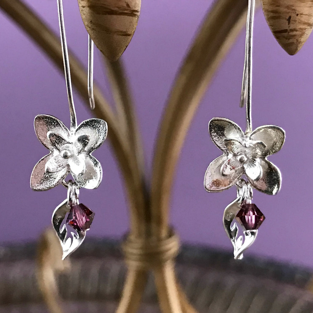 This Suzie Q Studio earring collection features handmade earrings created by Suzie Q Studio artisans. If you love a more delicate, modern-natural look, these precious, handcrafted sterling silver flower earrings, with a hint of Swarovski sparkle, are perfect for you and they're available in a variety of gorgeous colors.