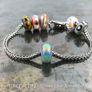 Now available at Suzie Q Studio, the ultra-rare Trollbeads Tibet Beads. This is the GREEN LILAC ARMADILLO bead in the Trollbeads Tibet Set #2.