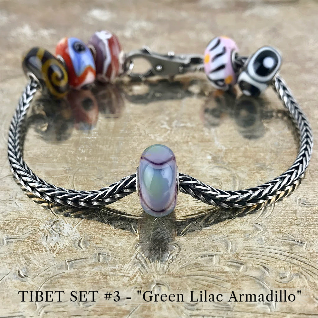 Now available at Suzie Q Studio, the ultra-rare Trollbeads Tibet Beads. This is the GREEN LILAC ARMADILLO bead in the Trollbeads Tibet Set #3.