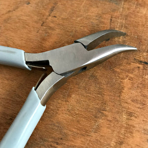 When it comes to making jewelry, if you want professional looking results, using Suzie Q Studio's jewelry-making tools is the way to go! The “Bent Chain Nose Plier” is ideal for griping and bending. As well, because of their extra-pointy nose and curved jaws, they're able to get into even tighter spots than the regular Chain Nose Plier!