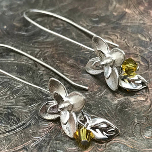 This Suzie Q Studio earring collection features handmade earrings created by Suzie Q Studio artisans. If you love a more delicate, modern-natural look, these precious, handcrafted sterling silver flower earrings, with a hint of Swarovski sparkle, are perfect for you and they're available in a variety of gorgeous colors.