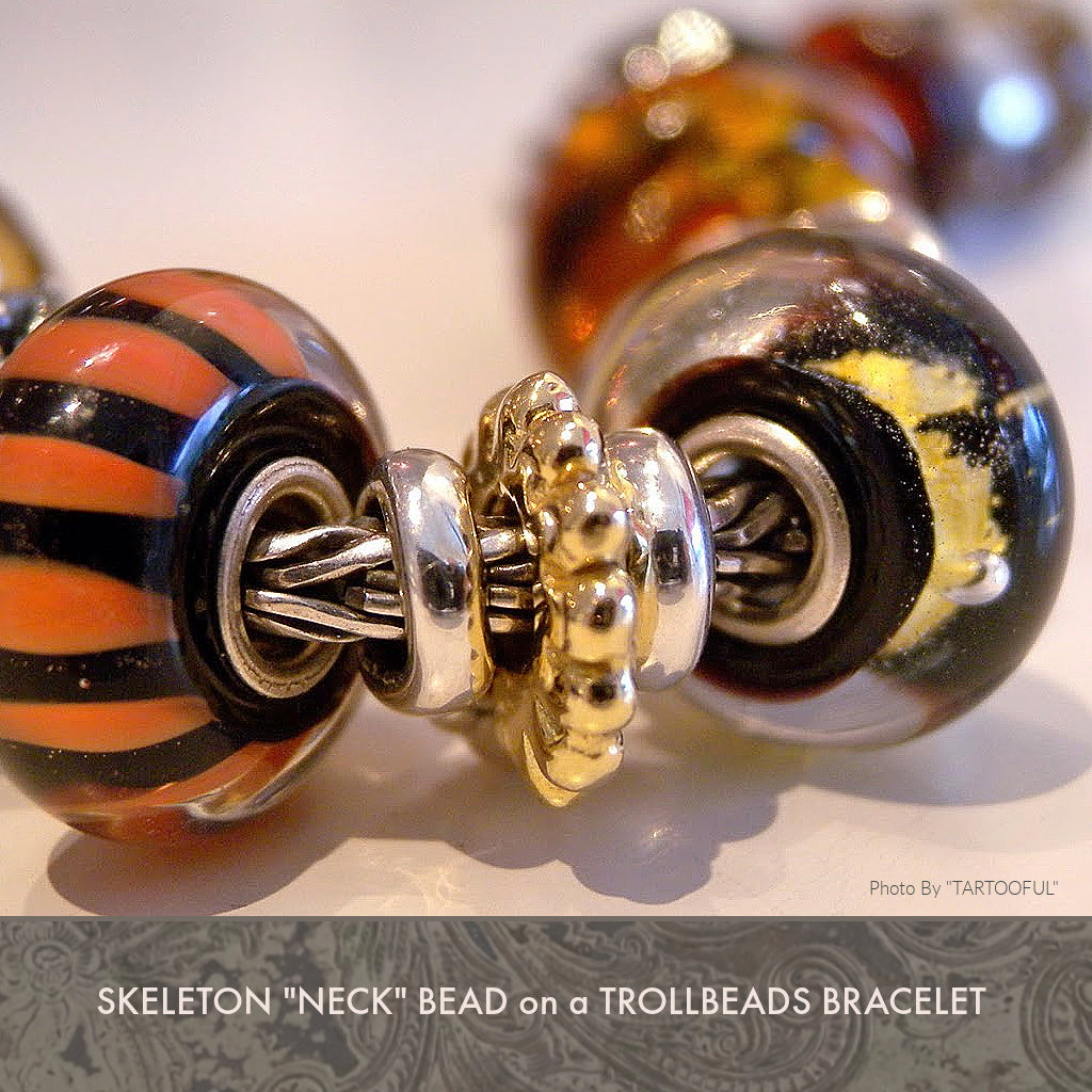 The detailing of Suzie Q Studio’s Trollbeads Skeleton Necklace is exquisite! It is made up of nine separate sterling silver pieces and a “sun circle” bead of solid 18KT gold. Some of these pieces can be removed and added to a Trollbeads bracelet.