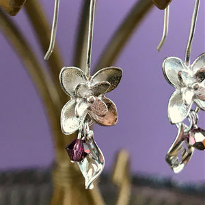 This Suzie Q Studio earring collection features handmade earrings created by Suzie Q Studio artisans. If you love a more delicate, modern-natural look, these precious, handcrafted sterling silver flower earrings, with a hint of Swarovski sparkle, are perfect for you and they're available in a variety of gorgeous colors.