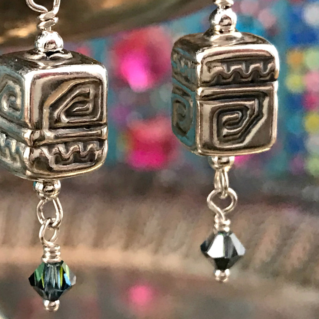 This Suzie Q Studio earring collection features handmade earrings created by Suzie Q Studio artisans. The geometric patterns on the electroformed (they’re hollow, so nice and light!) sterling silver beads featured in this pair of handmade earrings, have been used as sacred symbols, with the “spiral” representing positive energy and change. Choose your favourite colored crystal!