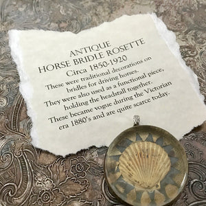 One-of-a-kind MY MOTHERS BUTTONS jewelry is handcrafted using the finest antique treasures. Glass-domed, bridle rosettes were a decoration for horse bridles. This pendant features a golden seashell design.