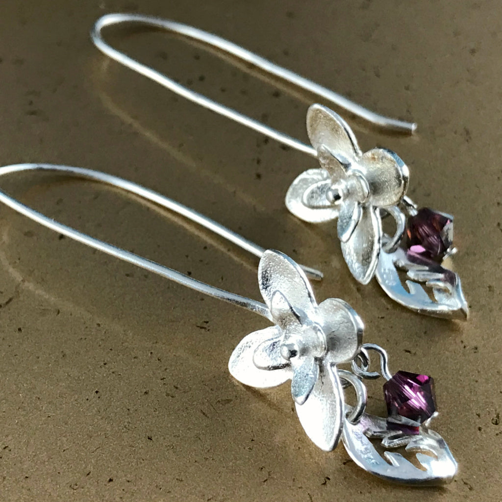 This Suzie Q Studio earring collection features handmade earrings created by Suzie Q Studio artisans. If you love a more delicate, modern-natural look, these precious, handcrafted sterling silver flower earrings, with a hint of Swarovski sparkle, are perfect for you and they're available in a variety of gorgeous colors.