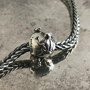 Suzie Q Studio has a treasure vault full of Rare and Retired Trollbeads... and we’re making them available to you. This rare, retired Sterling Silver Trollbead is decorated with frogs poking their heads out of the water, reflecting an image which Native Americans in the Southwest used to decorate their pottery.