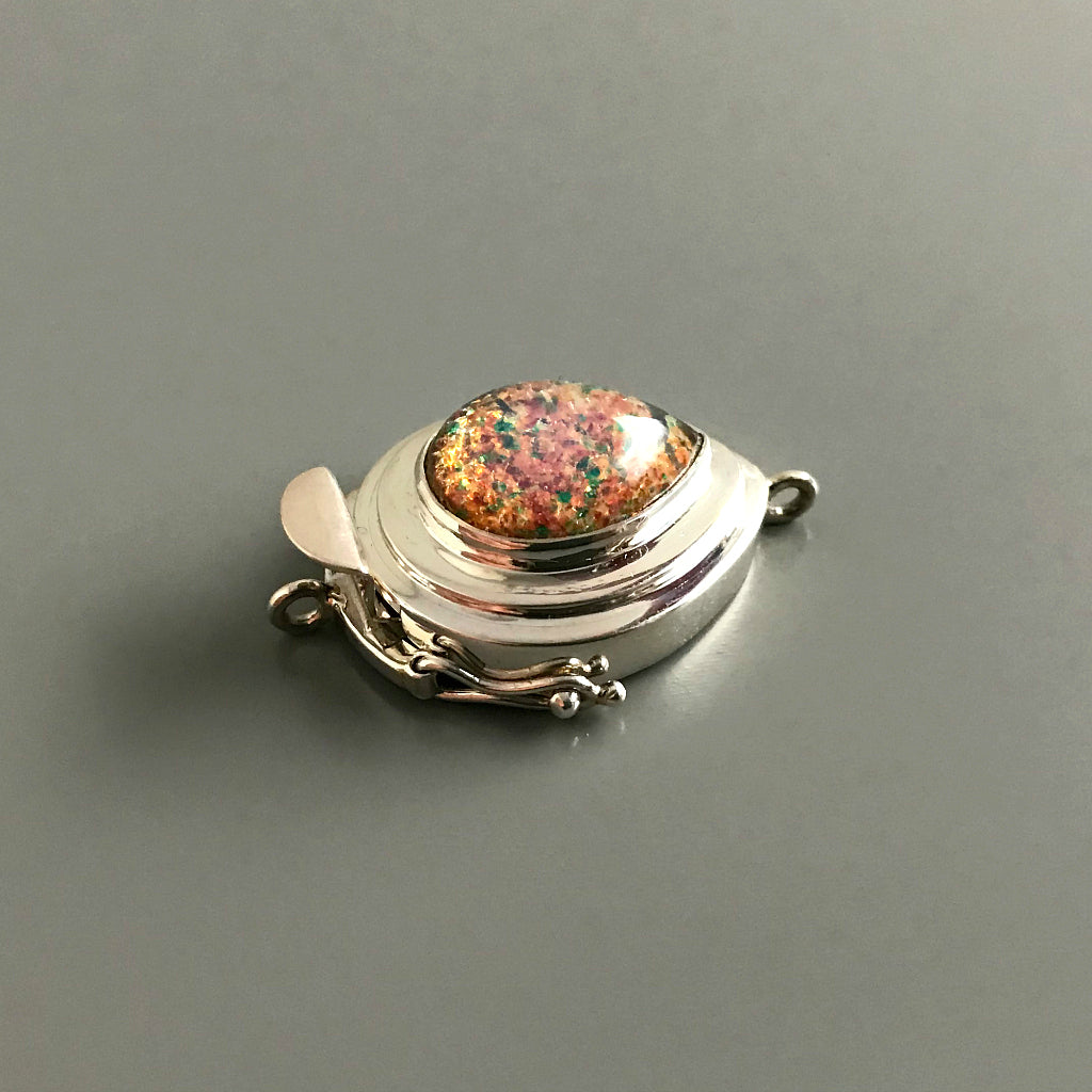 With the look of fire trapped under glass, this teardrop-shaped “Harlequin” vintage glass cabochon is simply stunning and will turn your jewelry design into a “showstopper”! This Suzie Q Studio custom box clasp was handcrafted with a substantial amount of sterling silver.