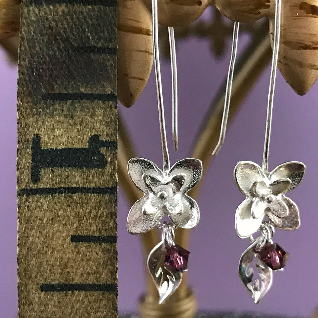 This Suzie Q Studio earring collection features handmade earrings created by Suzie Q Studio artisans. If you love a more delicate, modern-natural look, these precious, handcrafted sterling silver flower earrings, with a hint of Swarovski sparkle, are perfect for you and they're available in a variety of gorgeous colors.