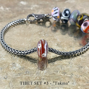 Now available at Suzie Q Studio, the ultra-rare Trollbeads Tibet Beads. This is the TAKMA bead in the Trollbeads Tibet Set #3.