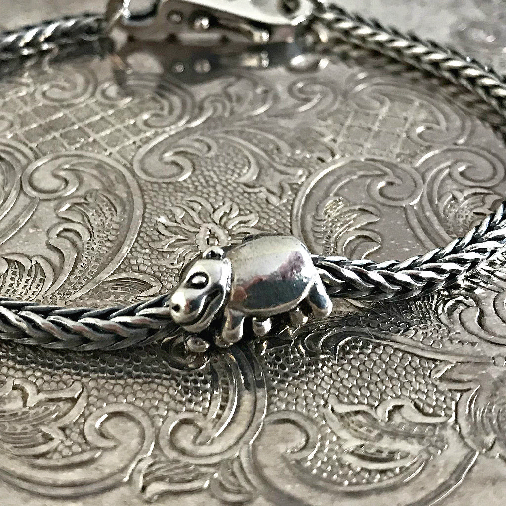 Suzie Q Studio has a treasure vault full of Rare and Retired Trollbeads... and we’re making them available to you. The hippopotamus bead is quite humorous, with the hippos almost stumbling over each other's legs.