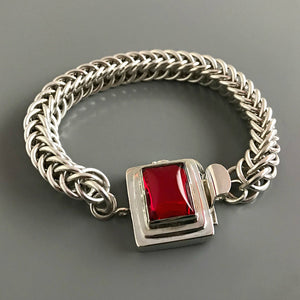 If you love red, this Suzie Q Studio box clasp is for you The color is absolutely scrumptious - not too orangey or too bluish! This custom box clasp was handcrafted with a vintage glass cabochon and set in a substantial amount of sterling silver to create a statement-making piece of jewelry.