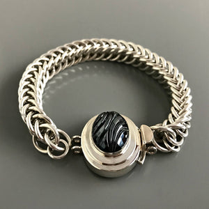 This Suzie Q Studio double-strand custom box clasp was handcrafted with an exquisite, oval-shaped “carved” vintage glass cabochon in a hematite stone-style finish and set in a substantial amount (more than average) of sterling silver, which gives this fab closure a look that can be casual, classic or totally upscale... The choice is yours!