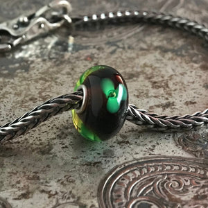 Suzie Q Studio has stashed away special glass, sterling silver and limited edition Trollbeads pieces in the Suzie Q Studio “Troll Treasures Vault”. This Trollbeads Retired Green Flower Glass Bead is a rare beauty. We’re adding lots more to our Trollbeads Rare and Retired Collection so check back often!
