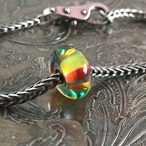 Suzie Q Studio has a treasure vault full of Rare and Retired Trollbeads... and we’re making them available to you. Luscious Trollbeads glass beads are handmade of Italian glass and each one is unique, such as this beautiful Green Rainbow Bead!