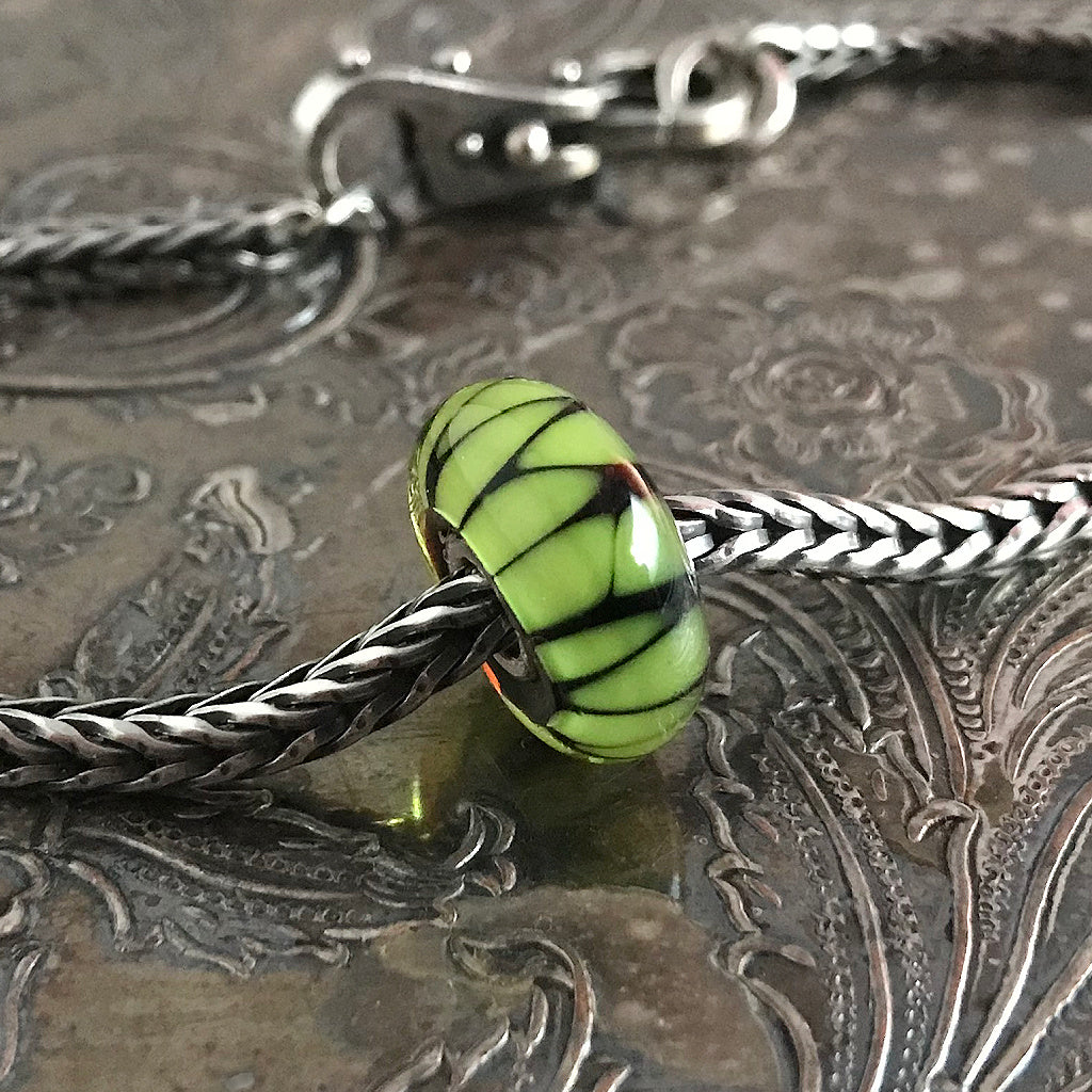Suzie Q Studio has stashed away special glass, sterling silver and limited edition Trollbeads pieces in the Suzie Q Studio “Troll Treasures Vault”. This Trollbeads Glass Bead Collection features some rare beauties, including this luscious Green Shade bead. We’re adding lots more to our Trollbeads Rare and Retired Collection so check back often!