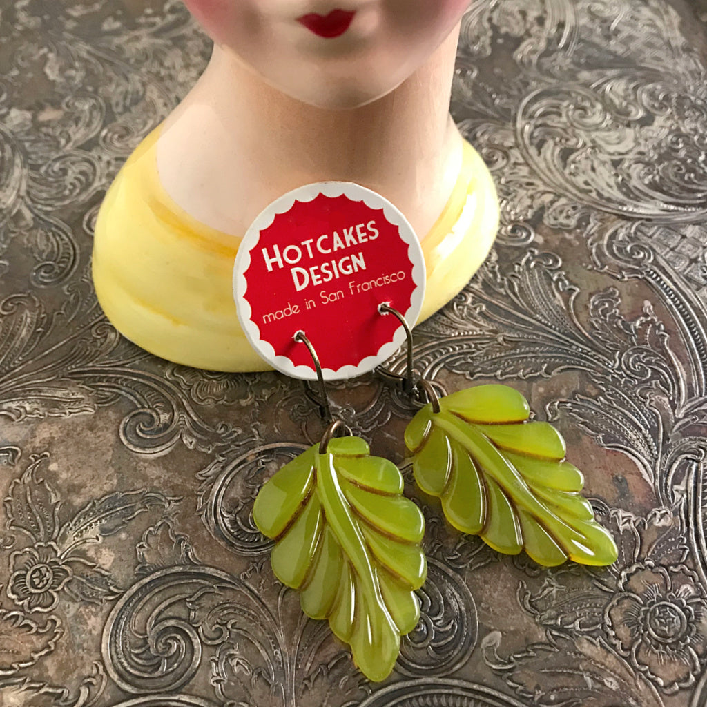 Suzie Q Studio carries HOTCAKES DESIGN retro-style, handmade jewelry taking its inspiration from classic Bakelite jewelry, vintage images and bold color. When you wear these earrings, the lush, glossy green color will put a “spring-in-your-step”.
