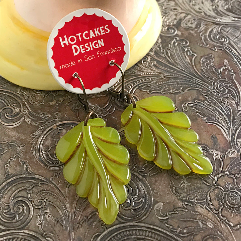 Suzie Q Studio carries HOTCAKES DESIGN retro-style, handmade jewelry taking its inspiration from classic Bakelite jewelry, vintage images and bold color. When you wear these earrings, the lush, glossy green color will put a “spring-in-your-step”.