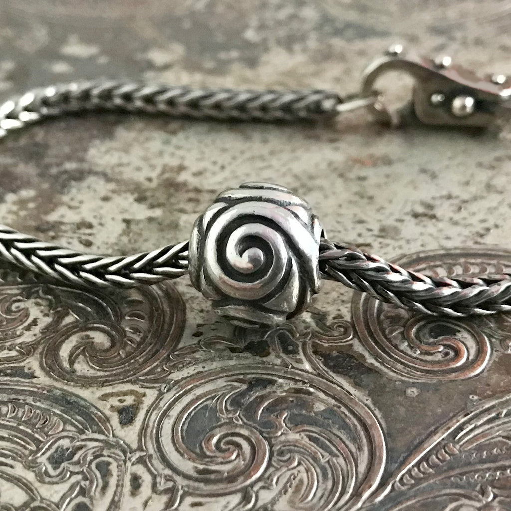 Suzie Q Studio has stashed away special glass, sterling silver and limited edition Trollbeads pieces in the Suzie Q Studio “Troll Treasures Vault”. This Trollbeads Retired Joyful Sterling Silver bead is a rare beauty. We’re adding lots more to our Trollbeads Rare and Retired Collection so check back often!
