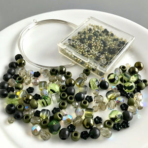 Suzie Q Studio's Serendipity BEAD STEW DIY EASY BRACELET MAKING KITS are limited edition collections of artfully curated premium quality beads and components for you to make one-of-a-kind bracelet(s). No experience needed!  With the subtle hint of warm-hued “basil” greens, along with the classic black of "poppy seeds", the BASIL POPPY SEED DRESSING bracelet kit is perfect for someone who enjoys a more understated, delicate look.