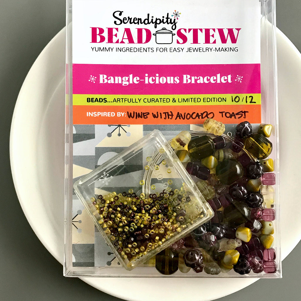 Suzie Q Studio's Serendipity BEAD STEW DIY EASY BRACELET MAKING KITS are limited edition collections of artfully curated premium quality beads and components for you to make a one-of-a-kind bracelet(s). No experience needed! The "Wine & Avocado Toast" Kit contains various shades of yellow-green, such as “olive” and “avocado", warm grey and purples.