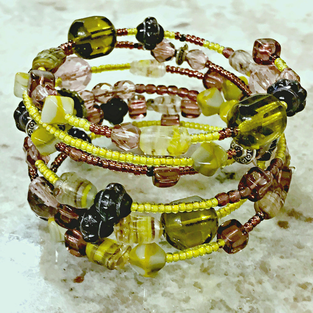 Suzie Q Studio's Serendipity BEAD STEW DIY EASY BRACELET MAKING KITS are limited edition collections of artfully curated premium quality beads and components for you to make a one-of-a-kind bracelet(s). No experience needed! The "Wine & Avocado Toast" Kit contains various shades of yellow-green, such as “olive” and “avocado", warm grey and purples.