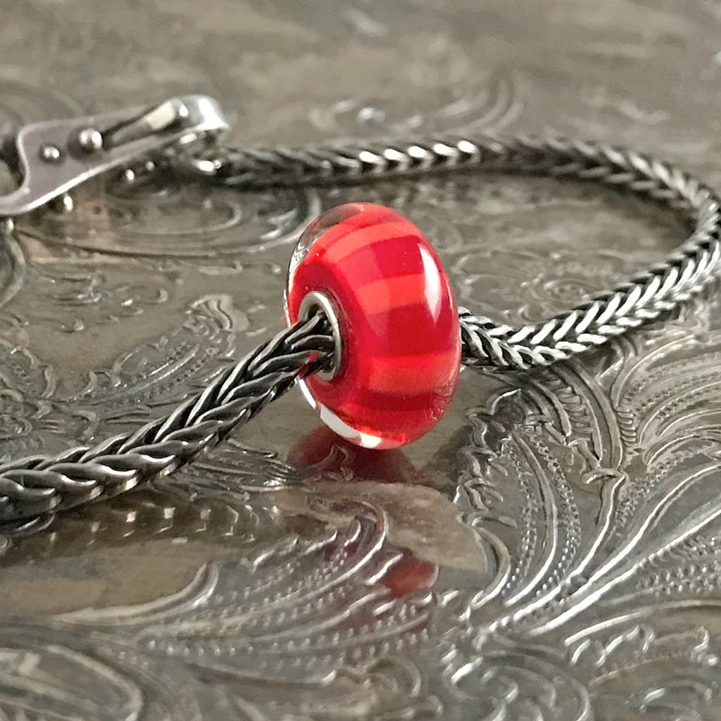 Suzie Q Studio has stashed away special glass, sterling silver and limited edition Trollbeads pieces in the Suzie Q Studio “Troll Treasures Vault”. This Trollbeads Glass Bead Collection features some rare beauties, such as this Red Stripe bead. We’re adding lots more to our Trollbeads Rare and Retired Collection so check back often!