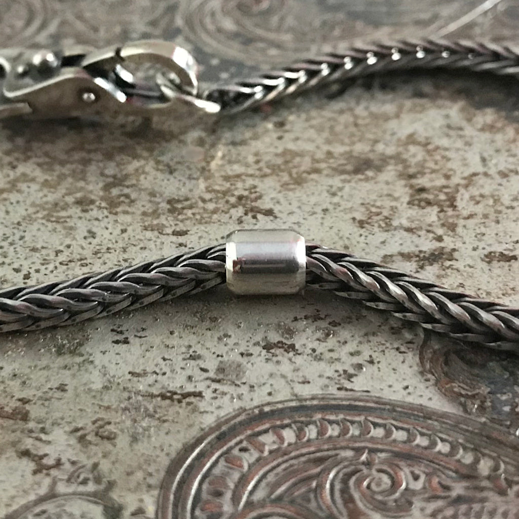 ​This Trollbead left the collection in 2008​.​  A time out from the hustle and bustle of life - or from the beads rolling back and forth on your bracelet. If you need a little space between beads, this can be useful.