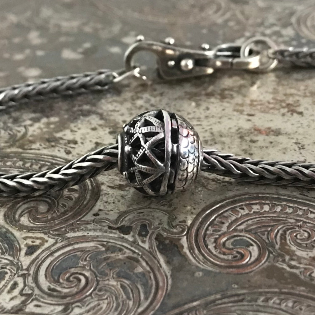 Suzie Q Studio has stashed away special glass, sterling silver and limited edition Trollbeads pieces in the Suzie Q Studio “Troll Treasures Vault”. This Trollbeads Retired Spiritual Ornament Sterling Silver bead is a rare beauty. We’re adding lots more to our Trollbeads Rare and Retired Collection so check back often!