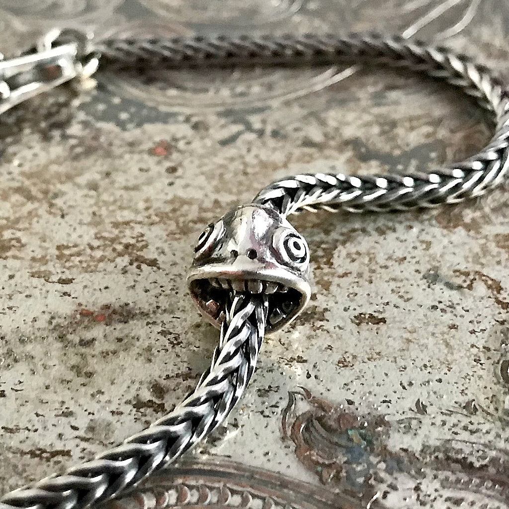 Suzie Q Studio has stashed away special glass, sterling silver and limited edition Trollbeads pieces in the Suzie Q Studio “Troll Treasures Vault”. This Trollbeads Retired Tupilak Mouth Sterling Silver bead is a rare find. We’re adding lots more to our Trollbeads Rare and Retired Collection so check back often!
