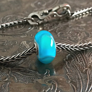 Suzie Q Studio has stashed away special glass, sterling silver and limited edition Trollbeads pieces in the Suzie Q “Troll Treasures Vault”. This Trollbeads Glass Bead Collection features some rare beauties, such as this gorgeous Turquoise Armadillo bead. We’re adding lots more to our Trollbeads Rare and Retired Collection so check back often!