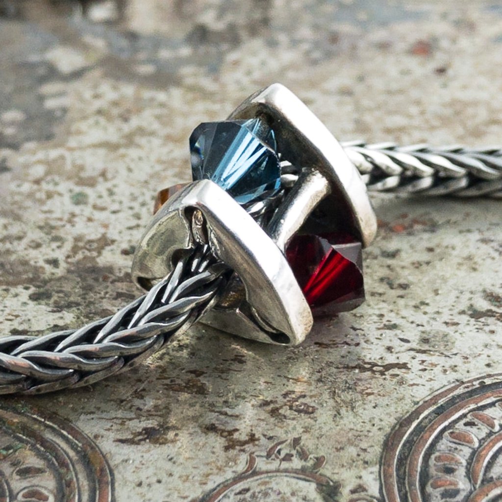 This Trollbead left the collection in 2013.  The dark, warm colours of the Swarovski crystals sparkle like the rarest jewels in this priceless bead.