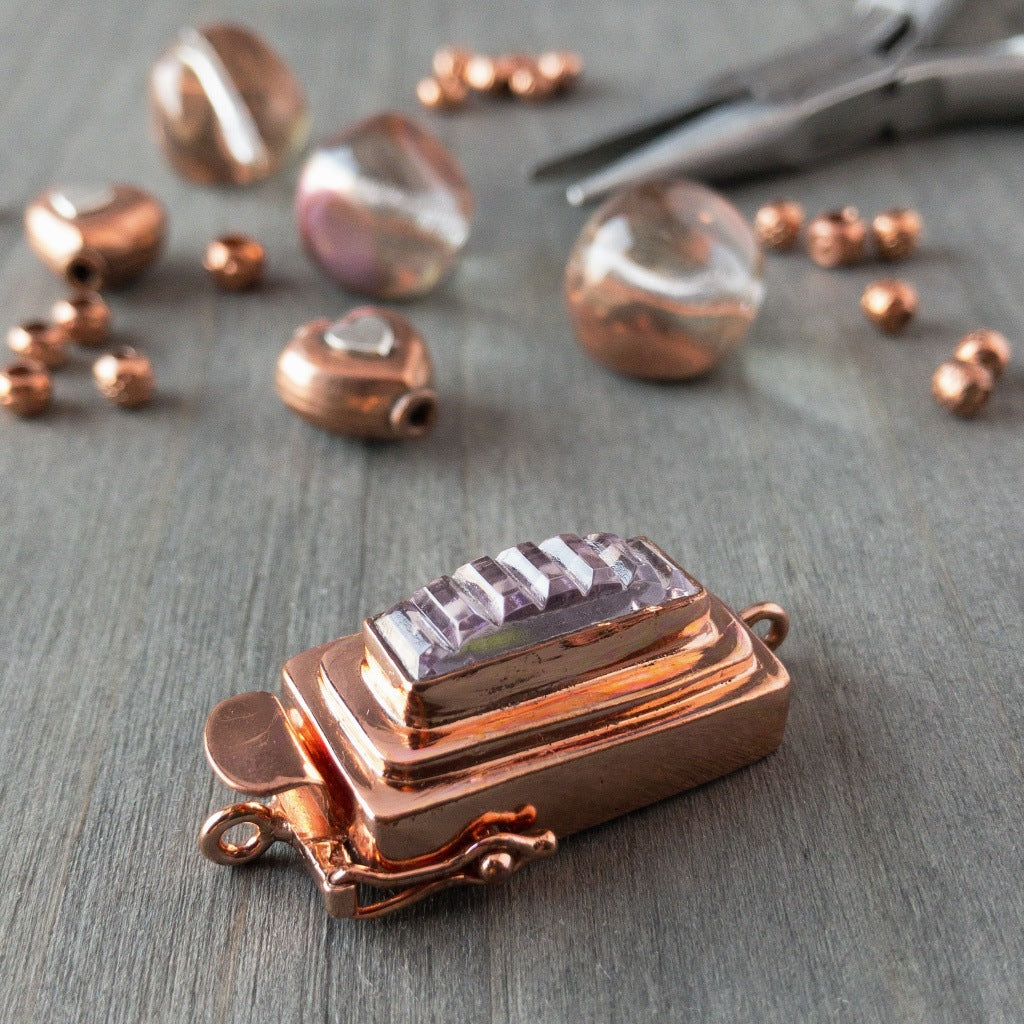 ​This custom box clasp features a slim, rectangle-shaped, vintage glass cabochon, with geometric ridges cut into the surface of the clear crystal glass, giving this piece a totally fab, art-deco look, which was individually handcrafted in 100% pure copper, exclusively for Suzie Q Studio.