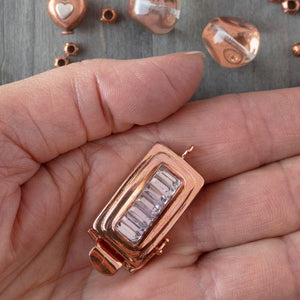 ​This custom box clasp features a slim, rectangle-shaped, vintage glass cabochon, with geometric ridges cut into the surface of the clear crystal glass, giving this piece a totally fab, art-deco look, which was individually handcrafted in 100% pure copper, exclusively for Suzie Q Studio.