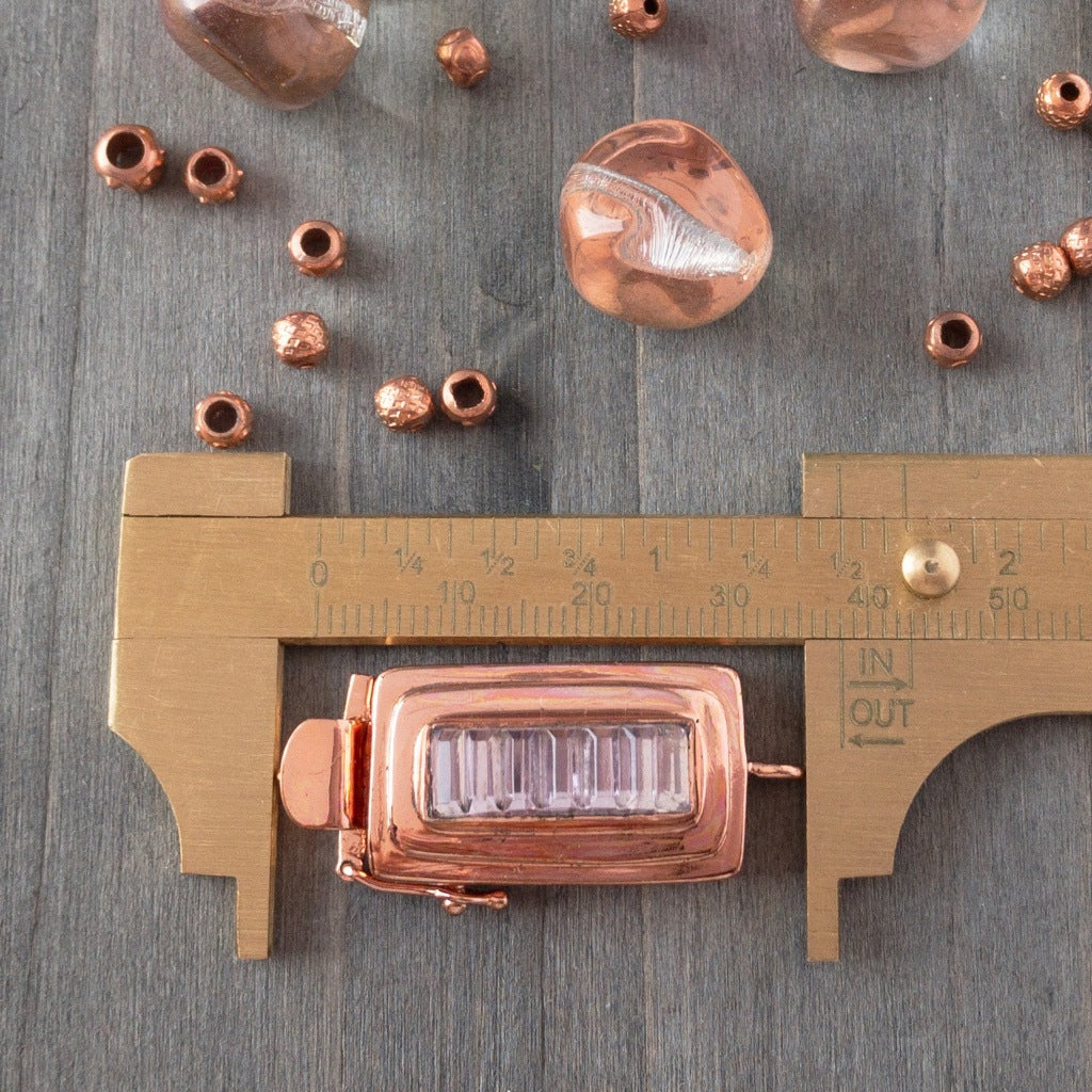 ​This custom box clasp features a slim, rectangle-shaped, vintage glass cabochon, with geometric ridges cut into the surface of the clear crystal glass, giving this piece a totally fab, art-deco look, which was individually handcrafted in 100% pure copper, exclusively for Suzie Q Studio.