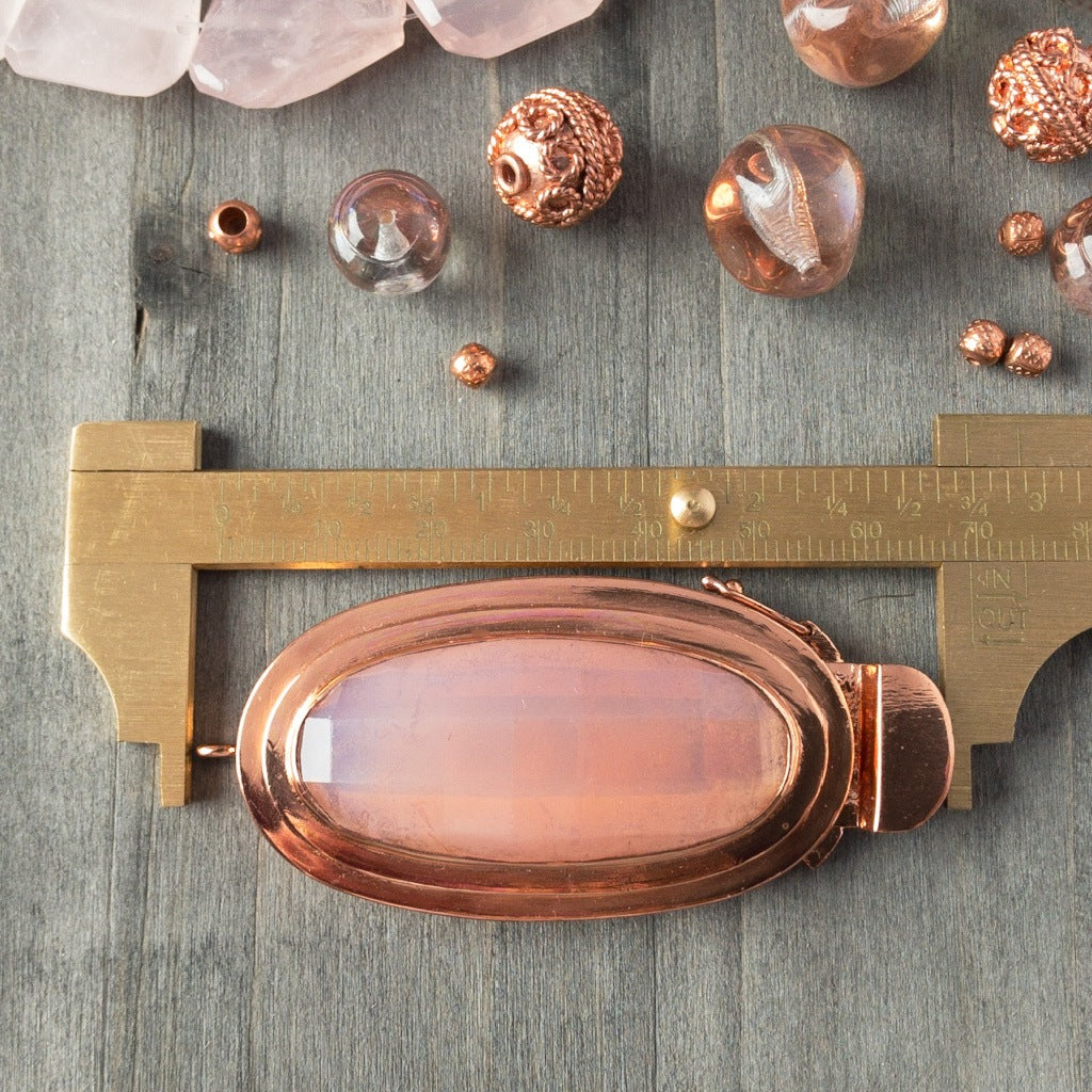 Featuring a scrumptious, pink opal-effect, faceted, vintage glass cabochon, the elongated oval-shape of this box clasp is truly striking! It was individually handcrafted in 100% pure copper, exclusively for Suzie Q Studio.