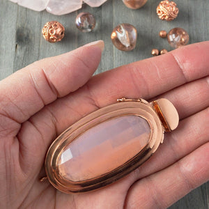 Featuring a scrumptious, pink opal-effect, faceted, vintage glass cabochon, the elongated oval-shape of this box clasp is truly striking! It was individually handcrafted in 100% pure copper, exclusively for Suzie Q Studio.
