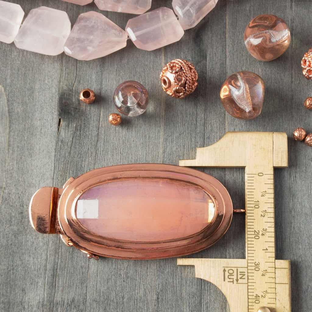 Featuring a scrumptious, pink opal-effect, faceted, vintage glass cabochon, the elongated oval-shape of this box clasp is truly striking! It was individually handcrafted in 100% pure copper, exclusively for Suzie Q Studio.