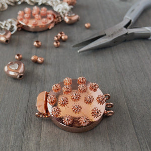 Embellished with adorable 3-D copper flowers, this triple strand, copper box clasp was individually handcrafted in 100% pure copper, exclusively for Suzie Q Studio.