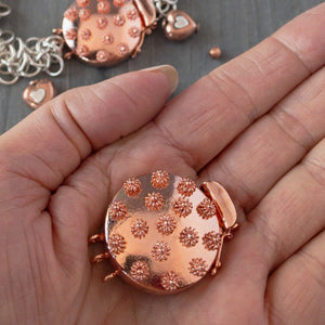 Embellished with adorable 3-D copper flowers, this triple strand, copper box clasp was individually handcrafted in 100% pure copper, exclusively for Suzie Q Studio.