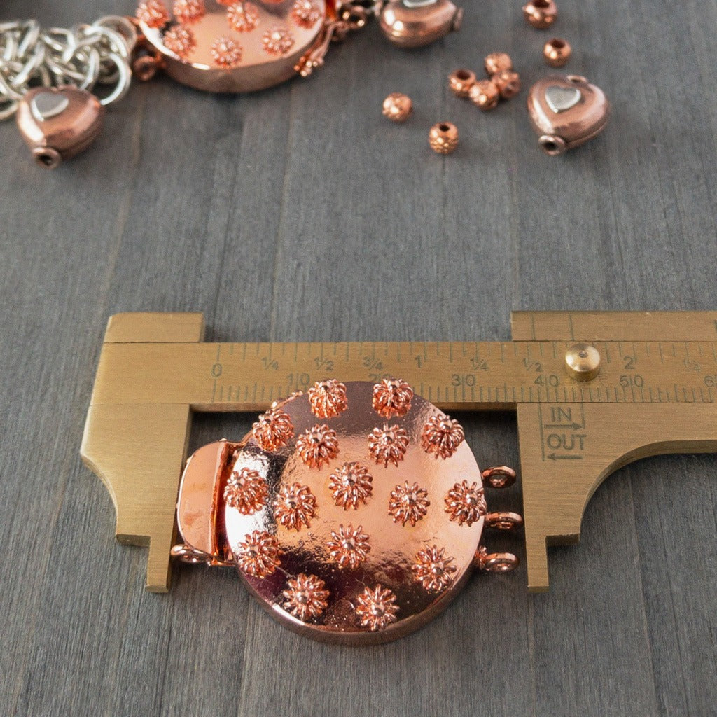 Embellished with adorable 3-D copper flowers, this triple strand, copper box clasp was individually handcrafted in 100% pure copper, exclusively for Suzie Q Studio.